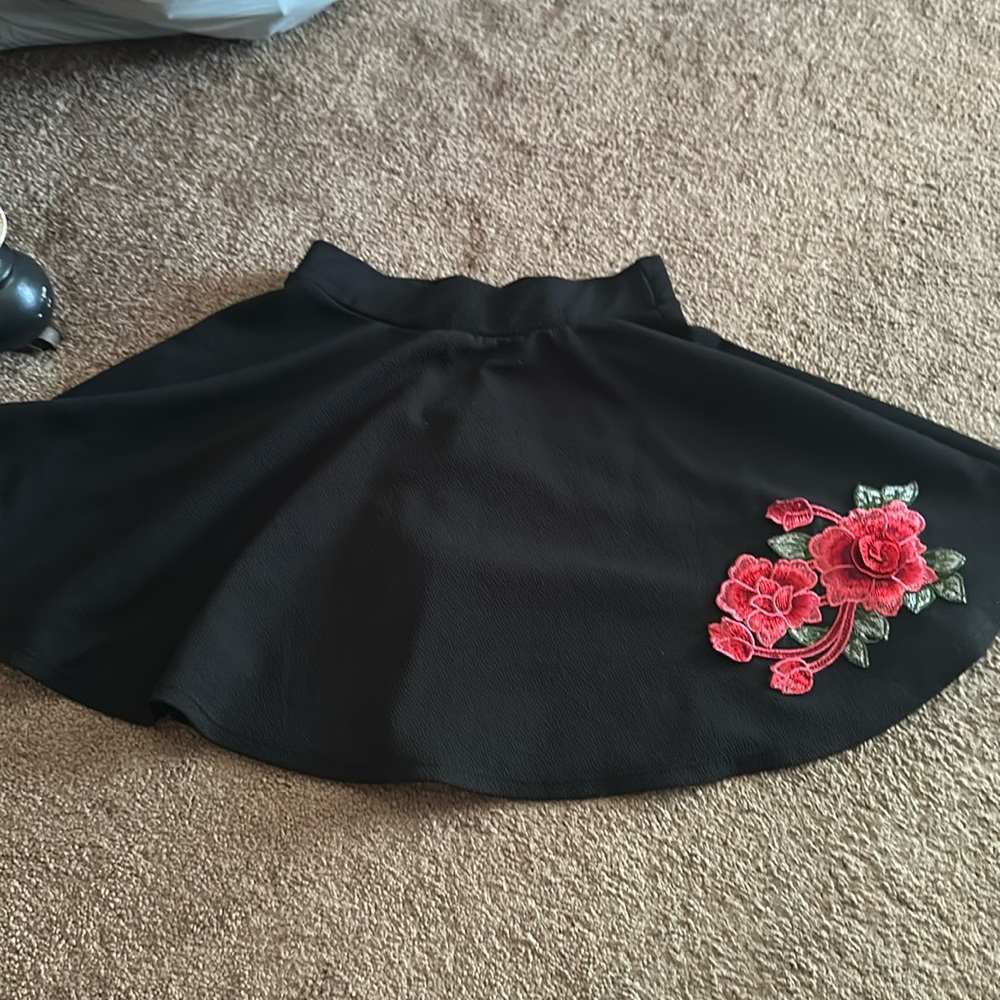 Black skirt with embroidered rose